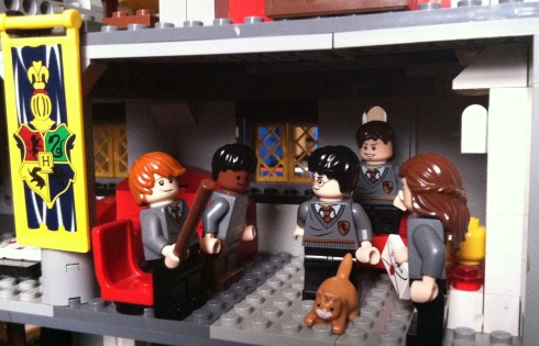 Ron, Dean, Harry, Neville and Hermione wonder if Crookshanks has eaten Scabbers in the Gryffindor common room